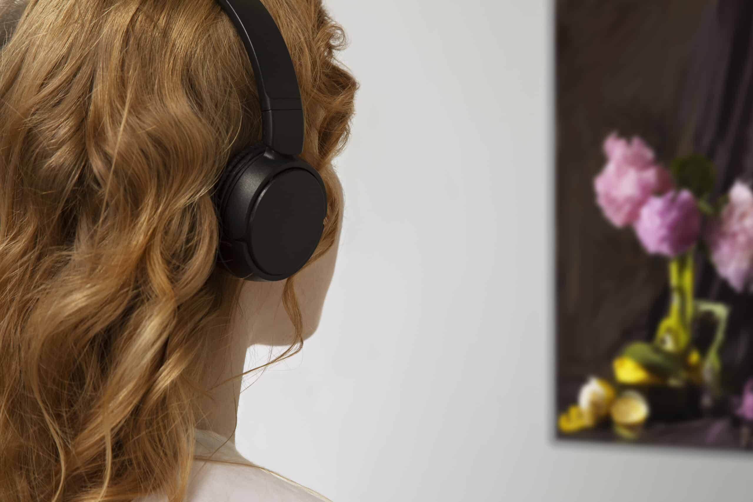 art gallery visitor listening to a personalised audio guide